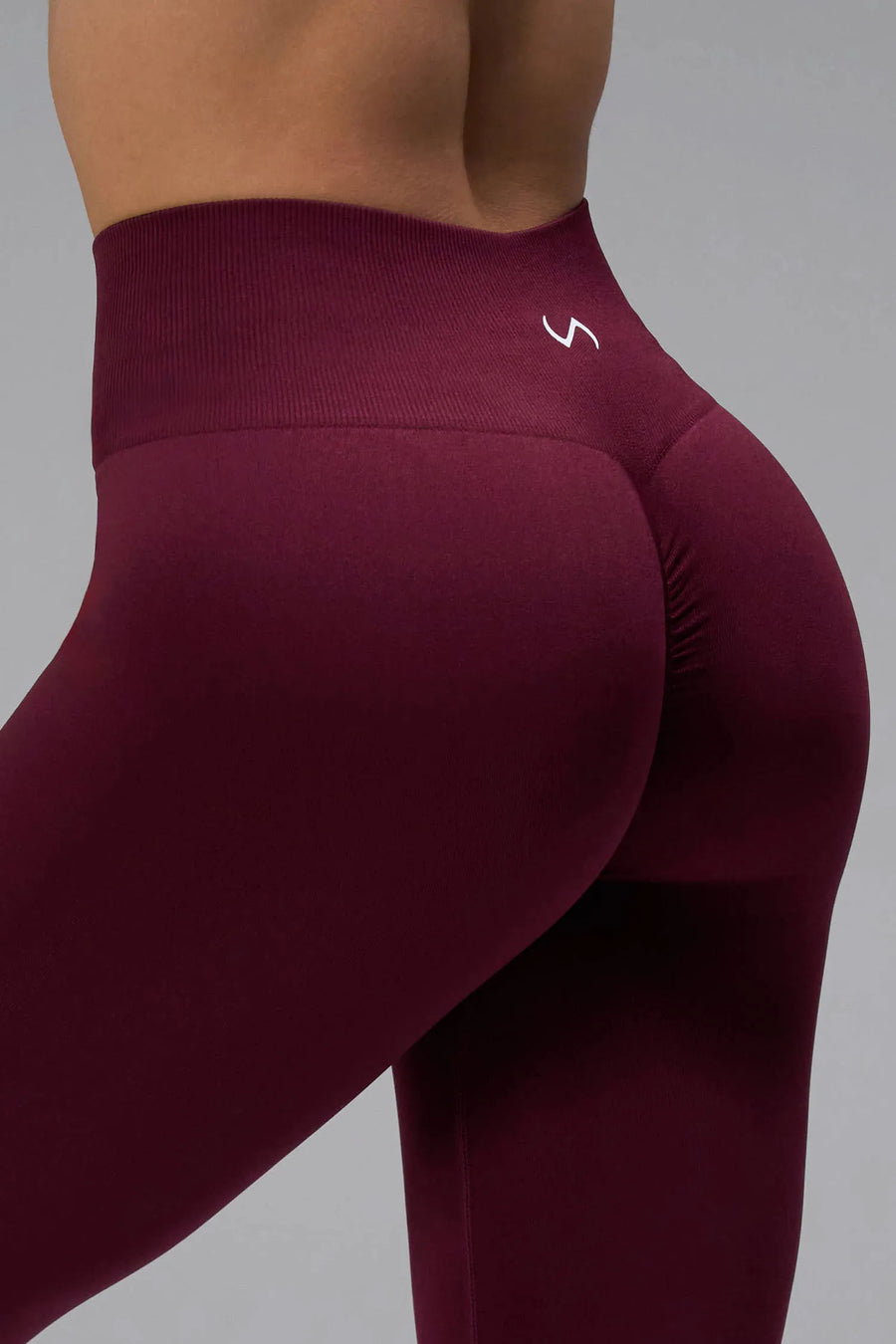 Back View of Dark Cherry TLF Cosmic Seamless Scrunch Butt Leggings, featuring a scrunch butt to shape and contour your glutes 