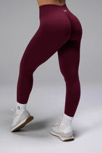 Side View of Dark Cherry TLF Cosmic Seamless Scrunch Butt Leggings, featuring a scrunch butt to shape and contour your glutes 