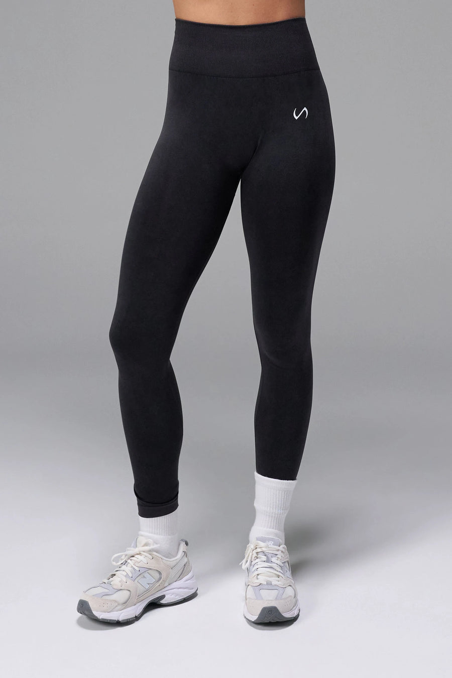 Black Cosmic Seamless Scrunch Butt Leggings with booty shaping ruching and glute contour seam for gym training and workouts by TLF Apparel – back view 