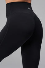 Back View of Black TLF NeoCloud™ Secret Glute Seam Leggings featuring our new secret glute seam technology to lift and shape your glutes. 