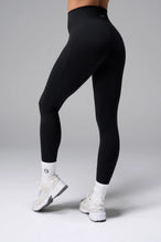 Front View of Black TLF NeoCloud™ Secret Glute Seam Leggings featuring our new secret glute seam technology to lift and shape your glutes. 