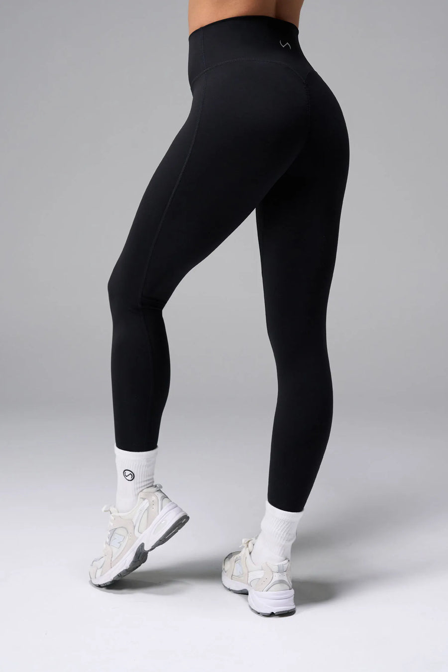 Front View of Black TLF NeoCloud™ Secret Glute Seam Leggings featuring our new secret glute seam technology to lift and shape your glutes. 
