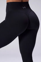Black NeoCloud™ Secret Glute Seam Leggings showing scrunch lift and sculpted glute silhouette by TLF Apparel – back view