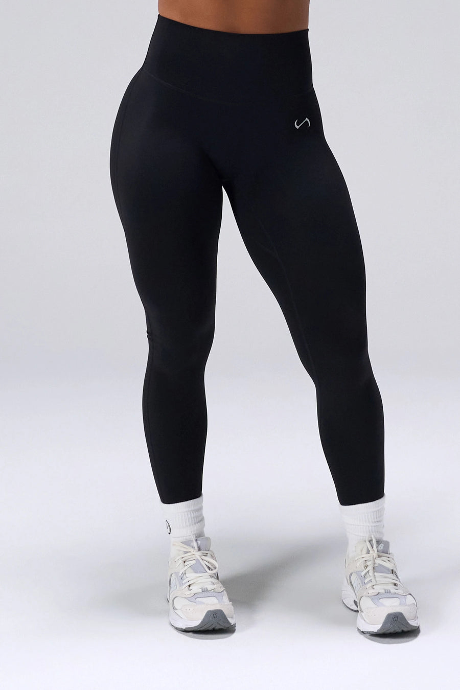 Black NeoCloud™ Secret Glute Seam Leggings with scrunch lift and breathable cloud-soft fabric for gym training by TLF Apparel – front view