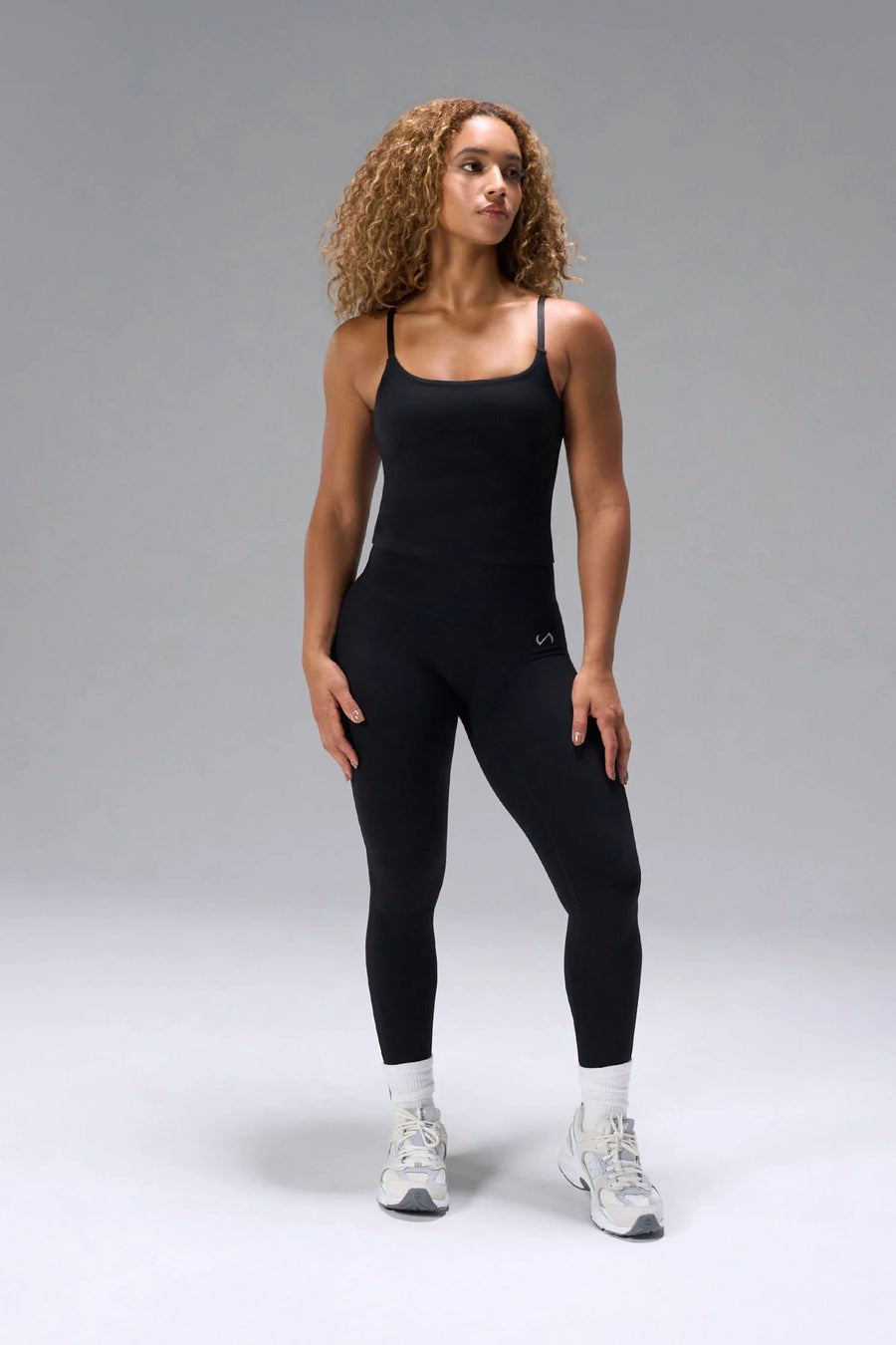 Black NeoCloud™ Secret Glute Seam Leggings showing high waist fit and sculpted side silhouette by TLF Apparel – front view