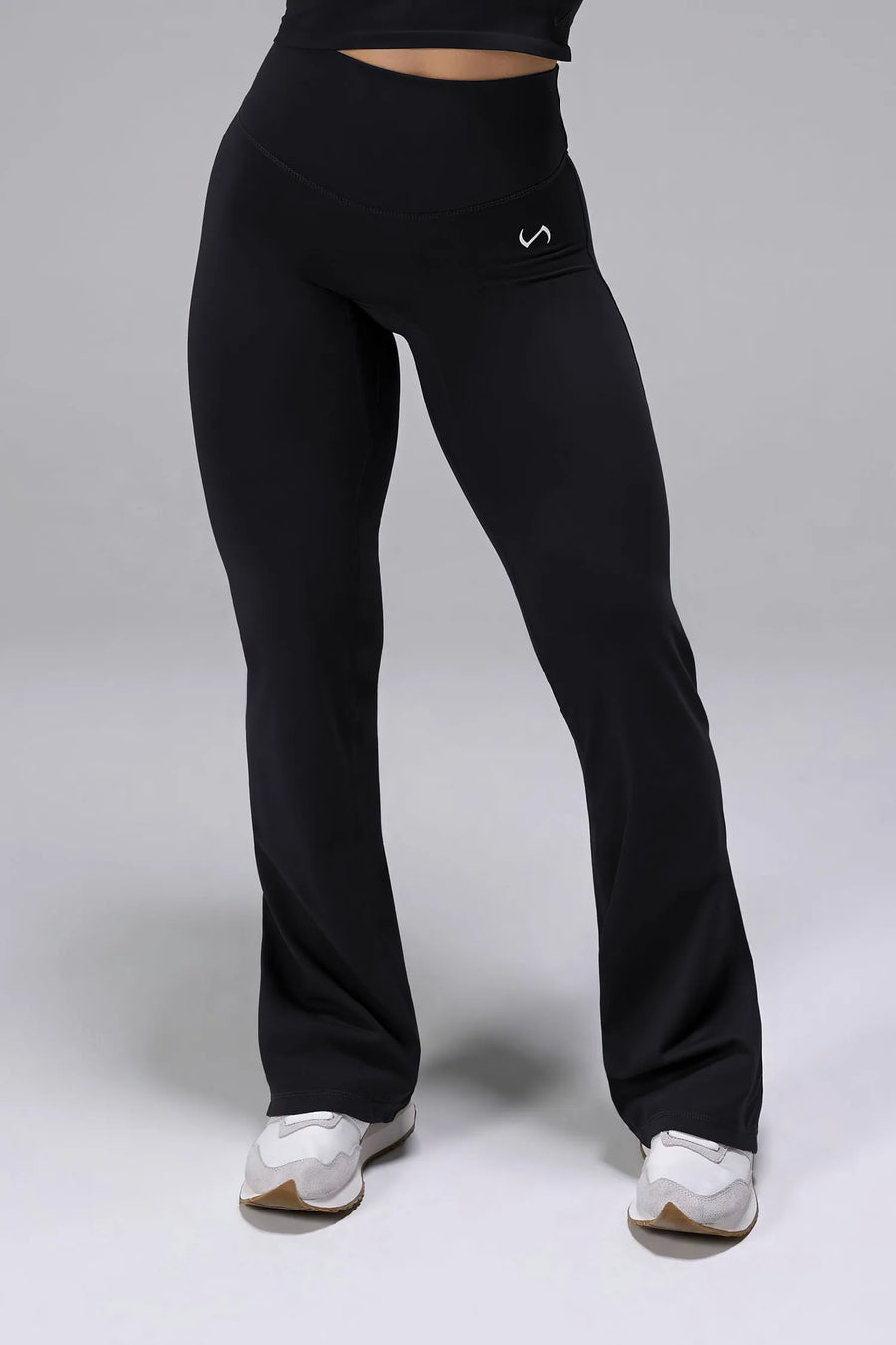 Front View of Black TLF Tempo High Waisted Split Hem Leggings feature our Luxe DNA fabric with a side split hem for style versatility