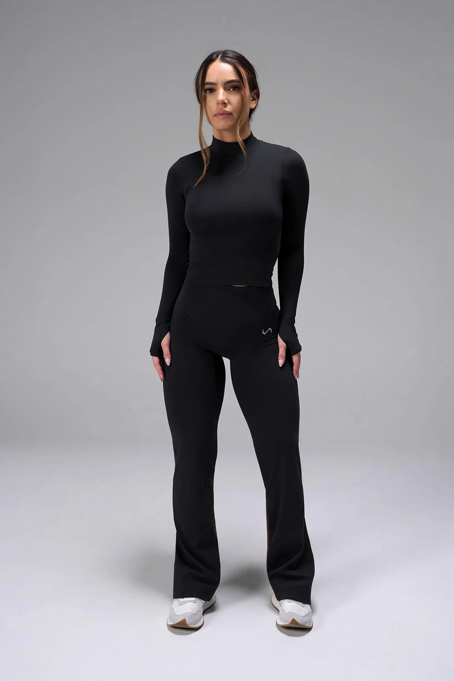 FrontView of Black TLF Tempo High Waisted Split Hem Leggings feature our Luxe DNA fabric with a side split hem for style versatility
