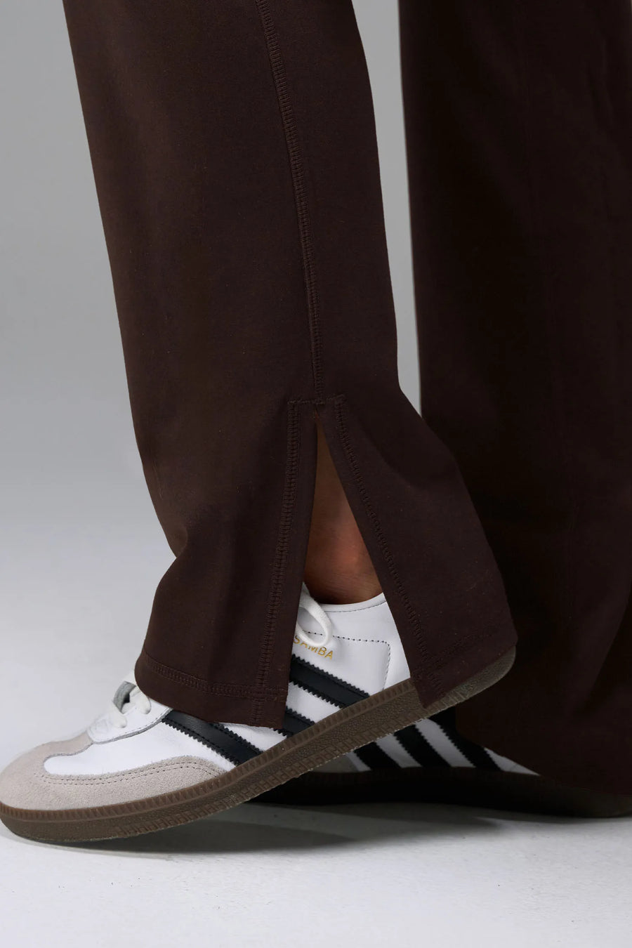 Side View of Brown TLF Tempo High Waisted Split Hem Leggings feature our Luxe DNA fabric with a side split hem for style versatility