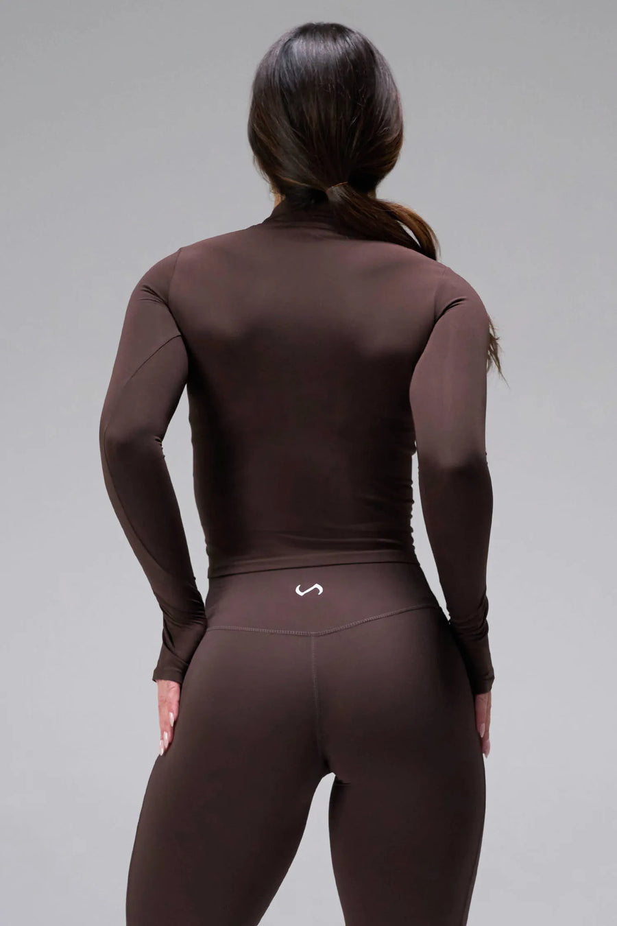 Back View of Brown TLF Tempo High Waisted Split Hem Leggings feature our Luxe DNA fabric with a side split hem for style versatility