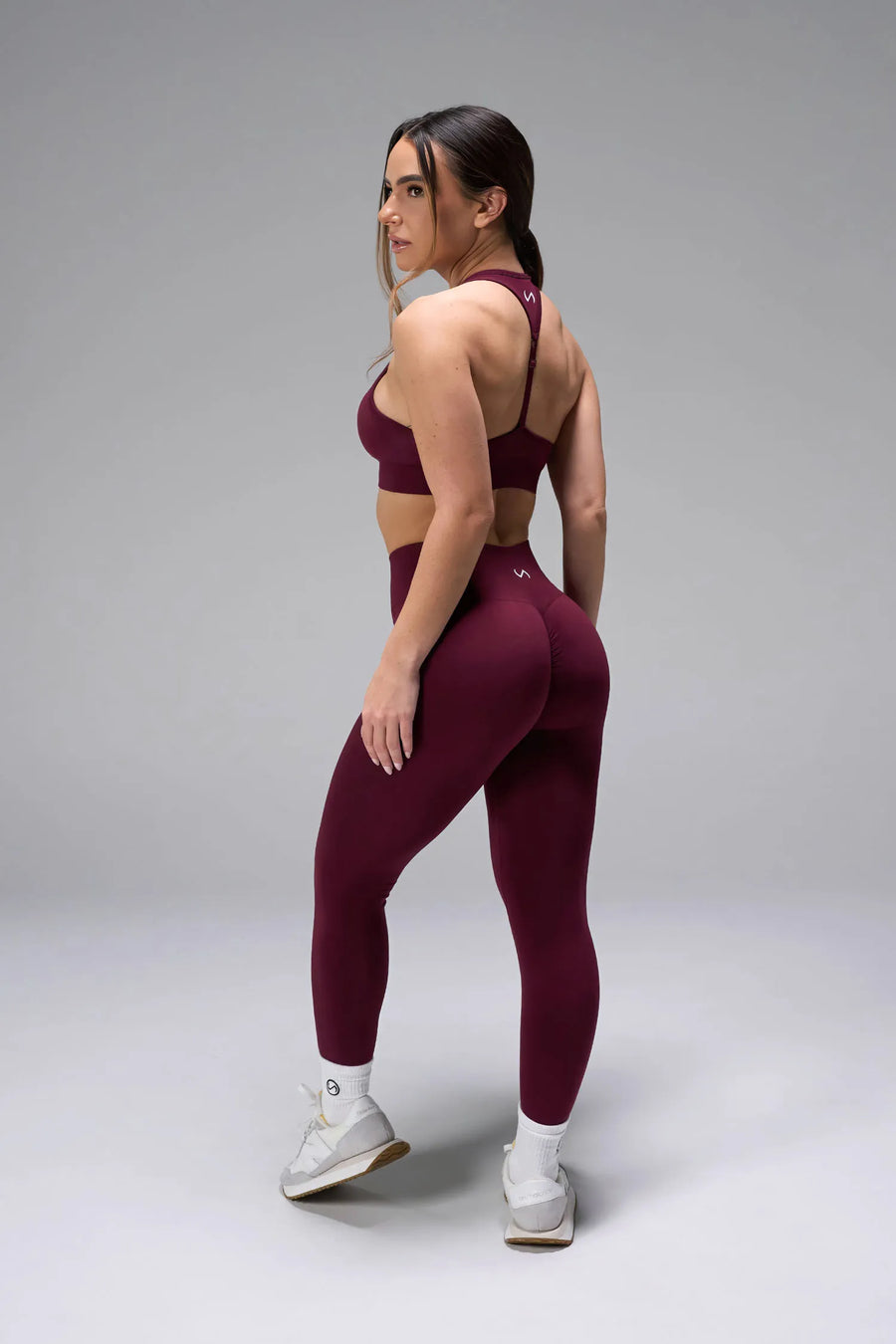 Side View of Dark Cherry TLF Cosmic Seamless Sports Bra features adjustable strap for custom fit with high support for performance and functionality