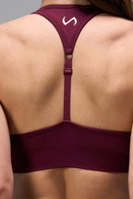 Side View of Dark Cherry TLF Cosmic Seamless Sports Bra features adjustable strap for custom fit with high support for performance and functionality