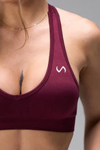 Side View of Dark Cherry TLF Cosmic Seamless Sports Bra features adjustable strap for custom fit with high support for performance and functionality