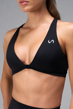 Black Tempo Front Clasp Sports Bra showing front clasp closure and Luxe DNA™ fabric detail by TLF Apparel – detail view