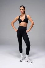Black Tempo Front Clasp Sports Bra with Luxe DNA™ fabric and medium support for workouts and training by TLF Apparel – front view