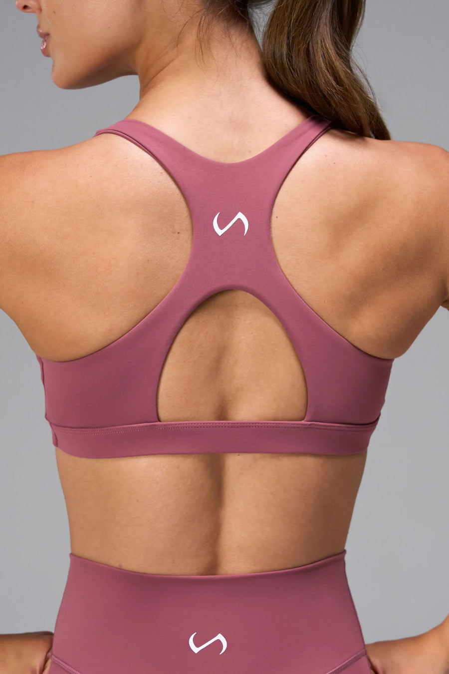 Pink Tempo Front Clasp Sports Bra with supportive racerback design and medium support for training by TLF Apparel – back detail view
