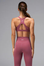 Pink Tempo Front Clasp Sports Bra with supportive racerback design and medium support for training by TLF Apparel – back view