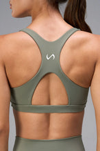 Green Tempo Front Clasp Sports Bra with supportive racerback design and medium support for training by TLF Apparel – back view