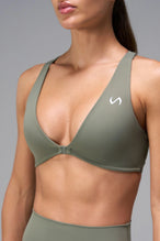 Green Tempo Front Clasp Sports Bra showing front clasp closure and Luxe DNA™ fabric detail by TLF Apparel – detail view