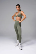 Green Tempo Front Clasp Sports Bra with Luxe DNA™ fabric and medium support for workouts and training by TLF Apparel – front view