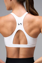 White Tempo Front Clasp Sports Bra with supportive racerback design and medium support for training by TLF Apparel – back detail view