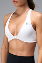 White Tempo Front Clasp Sports Bra showing front clasp closure and Luxe DNA™ fabric detail by TLF Apparel – detail view