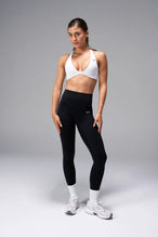 White Tempo Front Clasp Sports Bra with Luxe DNA™ fabric and medium support for workouts and training by TLF Apparel – front view