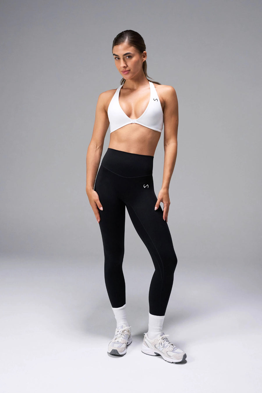 White Tempo Front Clasp Sports Bra with Luxe DNA™ fabric and medium support for workouts and training by TLF Apparel – front view