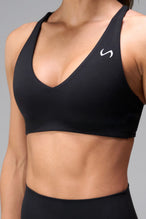 Black NeoCloud™ V-Neck Sports Bra with v neckline and medium support for the studio classes, pilates and gym training by TLF Apparel – front view 