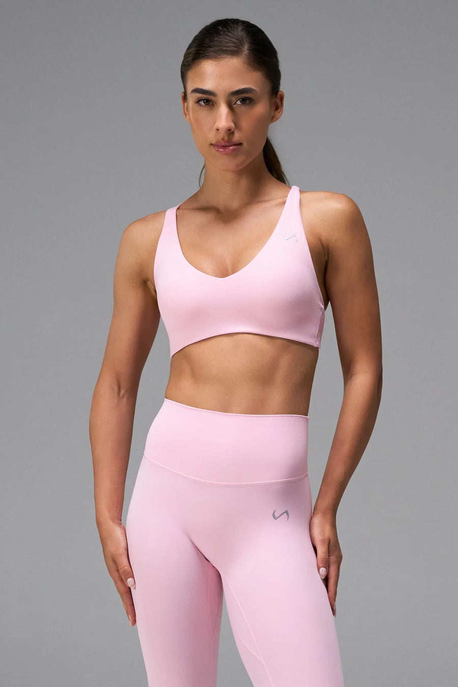 Pink NeoCloud™ V-Neck Sports Bra with v neckline and medium support for the studio classes, pilates and gym training by TLF Apparel – front view 