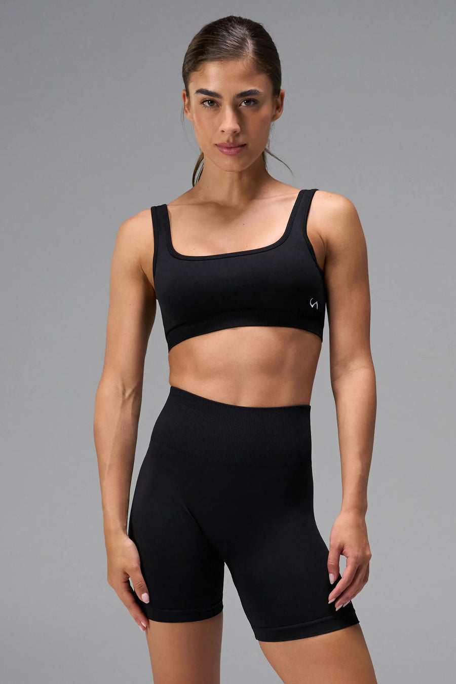 Black Cosmic Seamless Open Back Sports Bra with square neckline and medium support for gym training, workouts and all-day wear by TLF Apparel – front view 