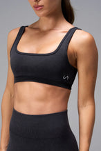Black Cosmic Seamless Open Back Sports Bra showing sculpted side fit and seamless performance fabric by TLF Apparel – side view 