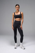 Black Cosmic Seamless Open Back Sports Bra with breathable open back and sculpting seamless fit for workouts and training by TLF Apparel – back view 