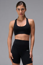 Black Tempo Racerback Sports Bra in Luxe DNA™ fabric, a reversible low impact sports bra by TLF Apparel – front view