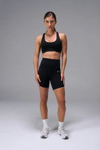 Black Tempo Racerback Sports Bra showing racerback design for full range of motion by TLF Apparel – front view