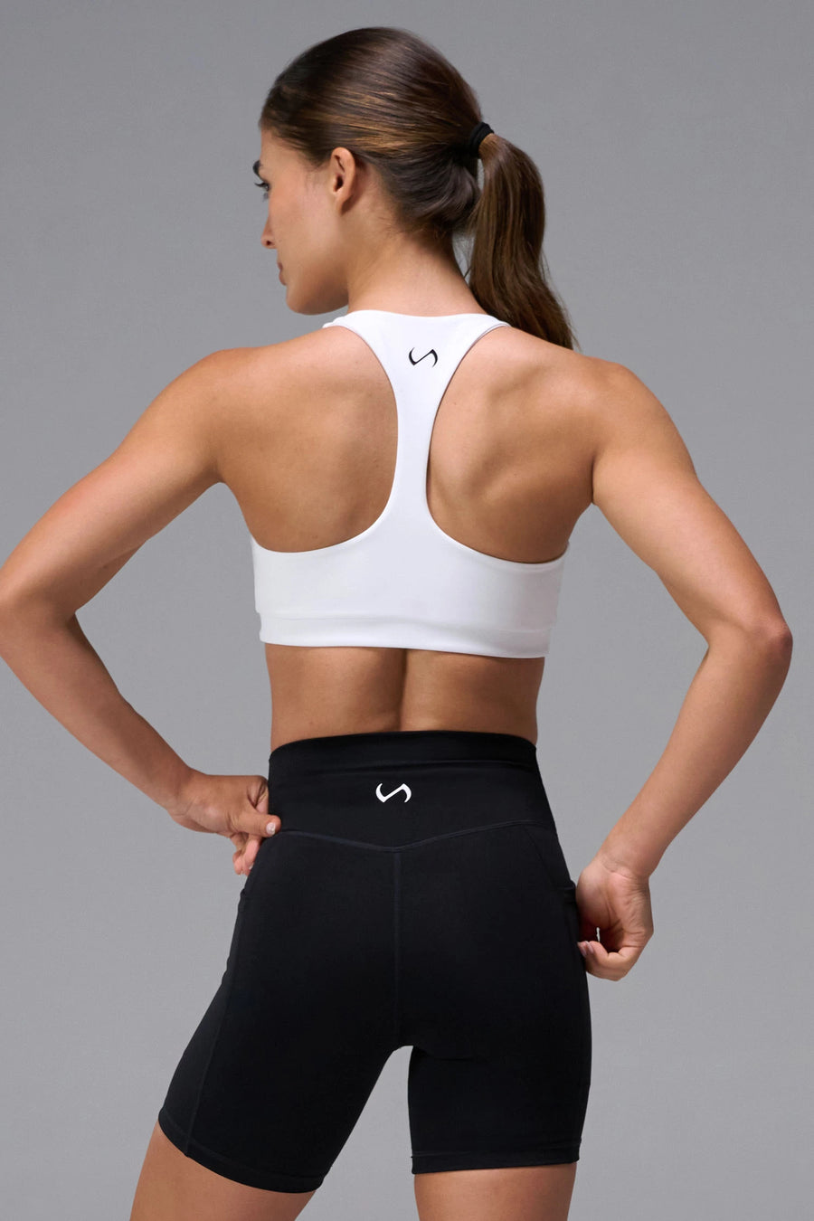 White Tempo Racerback Sports Bra showing supportive fit and racer back straps by TLF Apparel –  back view