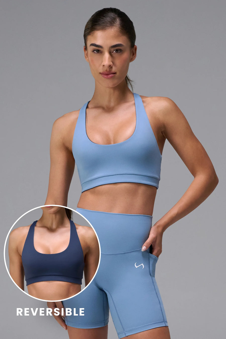 Navy Tempo Racerback Sports Bra in Luxe DNA™ fabric, a reversible low impact sports bra by TLF Apparel – front view