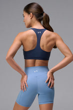Navy Tempo Racerback Sports Bra showing supportive fit and racer back straps by TLF Apparel – back view