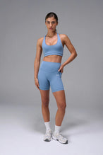 Navy Tempo Racerback Sports Bra, a reversible racerback bra for Gym-To-Street® wear by TLF Apparel – front view