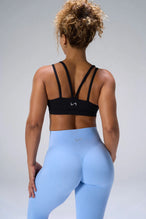 Black NeoCloud™ Strappy Sports Bra showing strappy back design and breathable cloud-soft fabric by TLF Apparel – back view