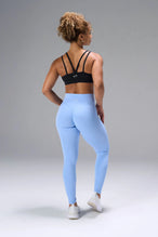 Black NeoCloud™ Strappy Sports Bra showing strappy back design and breathable cloud-soft fabric by TLF Apparel – back view