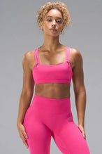 Pink NeoCloud™ Strappy Sports Bra with strappy back and medium support for gym training by TLF Apparel – front view