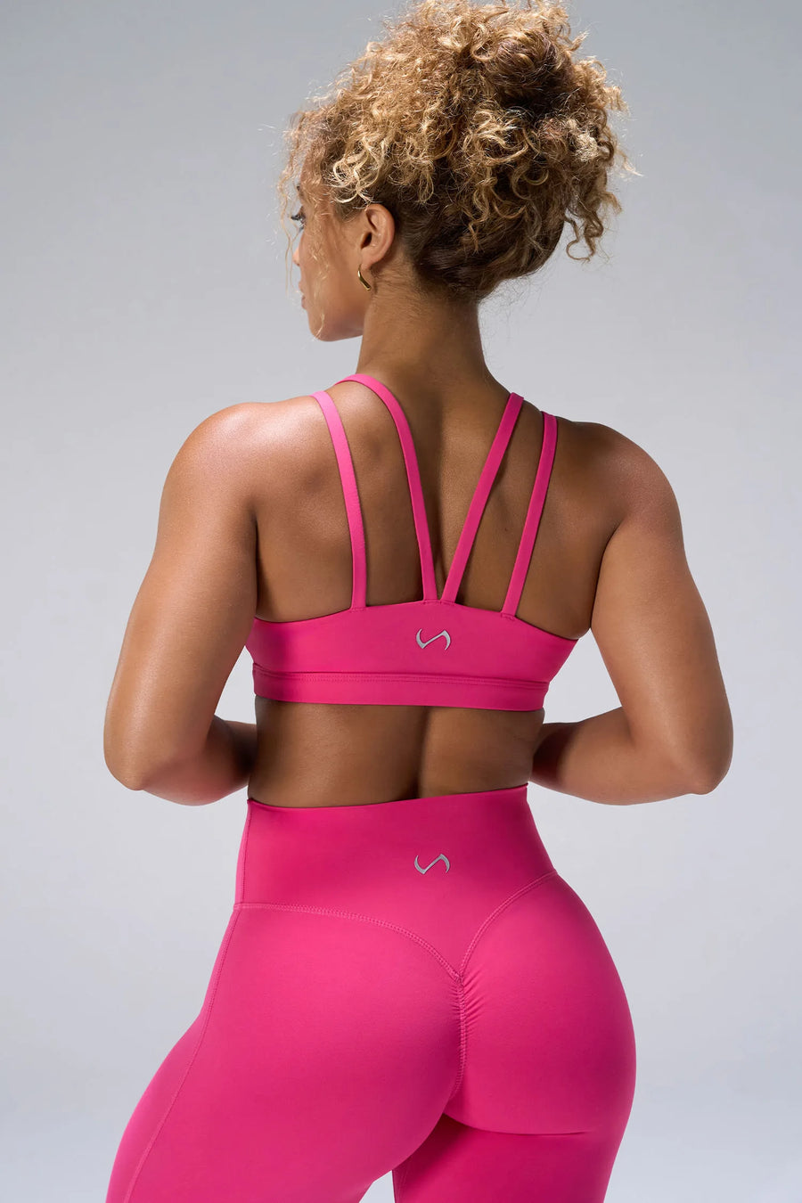 Pink NeoCloud™ Strappy Sports Bra showing strappy back design and breathable cloud-soft fabric by TLF Apparel – back view