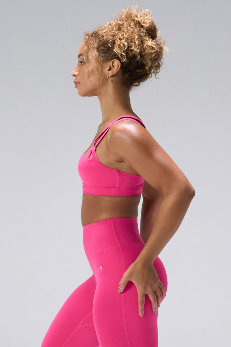 Pink NeoCloud™ Strappy Sports Bra showing strappy back, medium support, and breathable fabric by TLF Apparel – side view