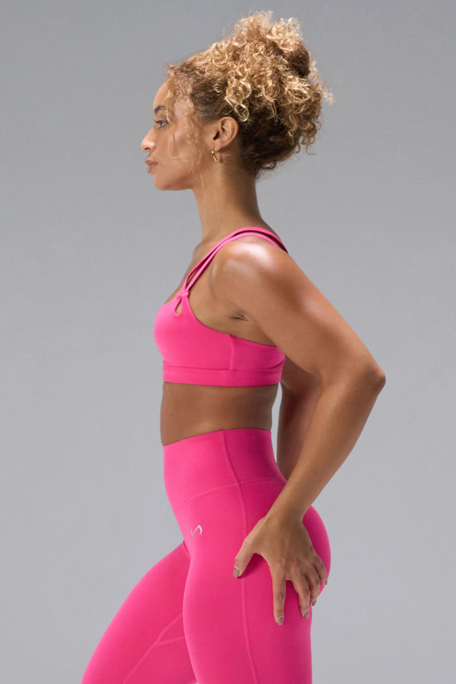 Pink NeoCloud™ Strappy Sports Bra showing strappy back, medium support, and breathable fabric by TLF Apparel – side view