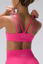 Pink NeoCloud™ Strappy Sports Bra showing NeoCloud™ fabric, strappy back, and removable pads by TLF Apparel – back detail view