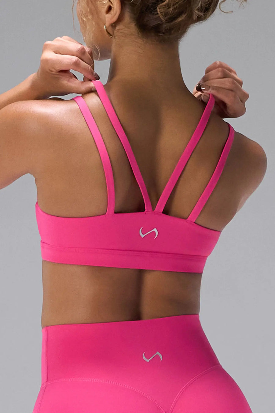 Pink NeoCloud™ Strappy Sports Bra showing NeoCloud™ fabric, strappy back, and removable pads by TLF Apparel – back detail view