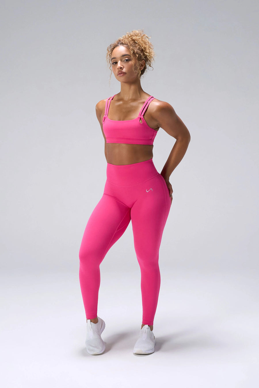 Pink NeoCloud™ Strappy Sports Bra showing side silhouette, medium support, and removable pads by TLF Apparel – front view