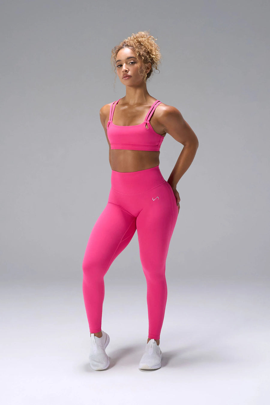 Pink NeoCloud™ Strappy Sports Bra showing side silhouette, medium support, and removable pads by TLF Apparel – front view