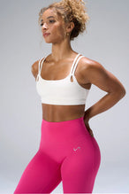 Cream NeoCloud™ Strappy Sports Bra showing side silhouette, medium support, and removable pads by TLF Apparel – side view