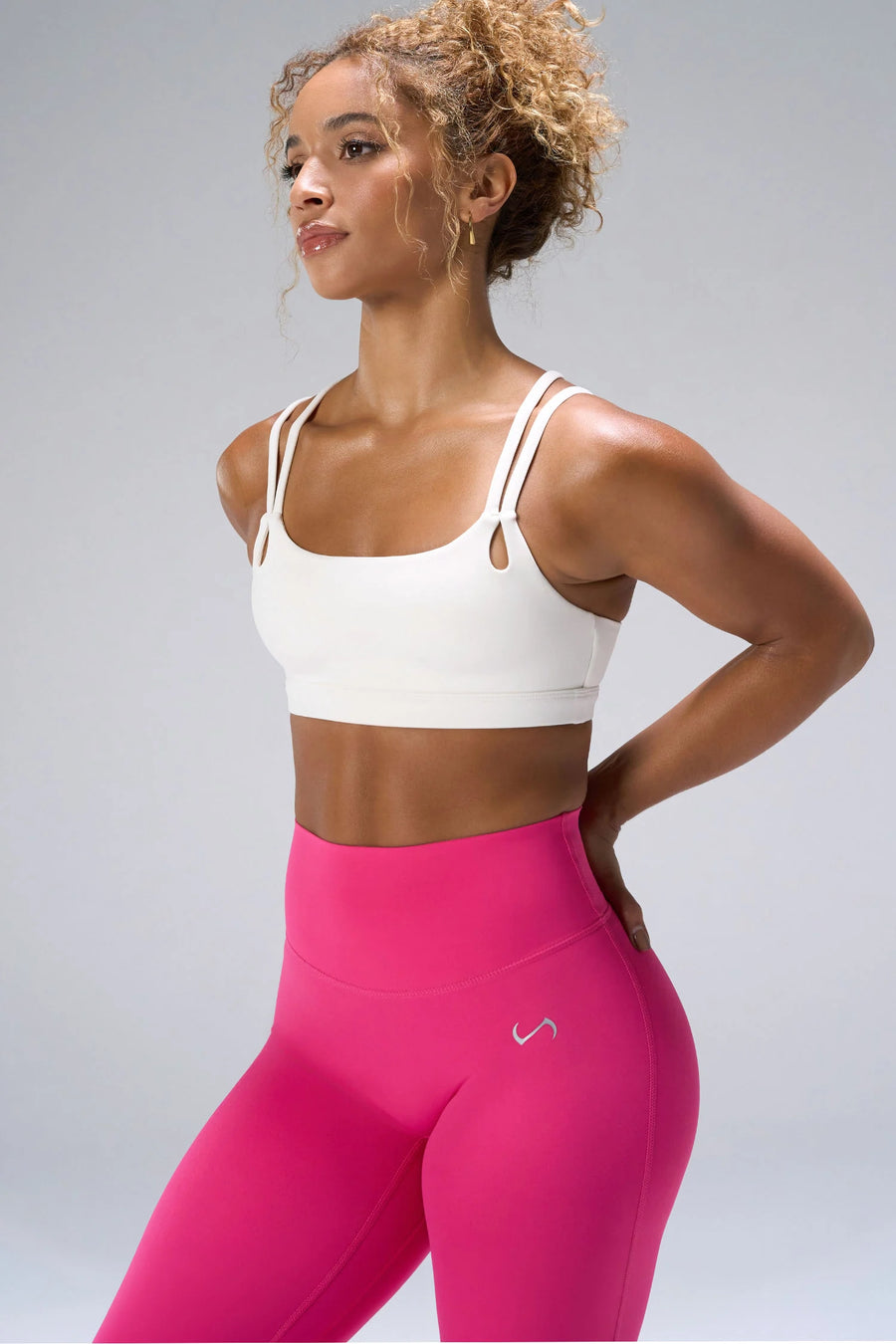 Cream NeoCloud™ Strappy Sports Bra showing side silhouette, medium support, and removable pads by TLF Apparel – side view